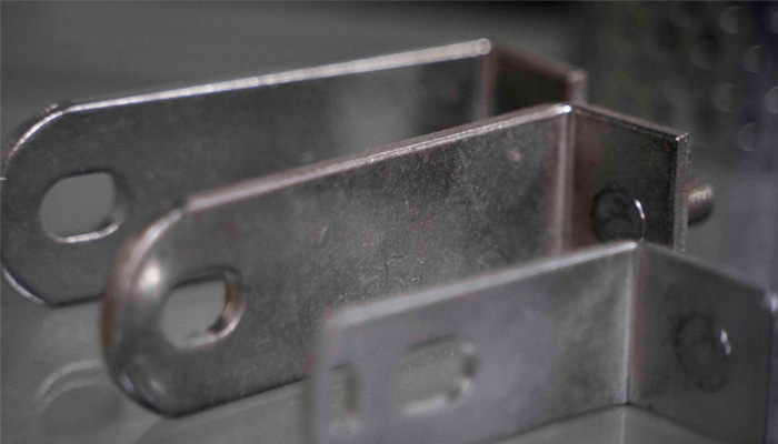 Close-up of tin plated bent metal brackets
