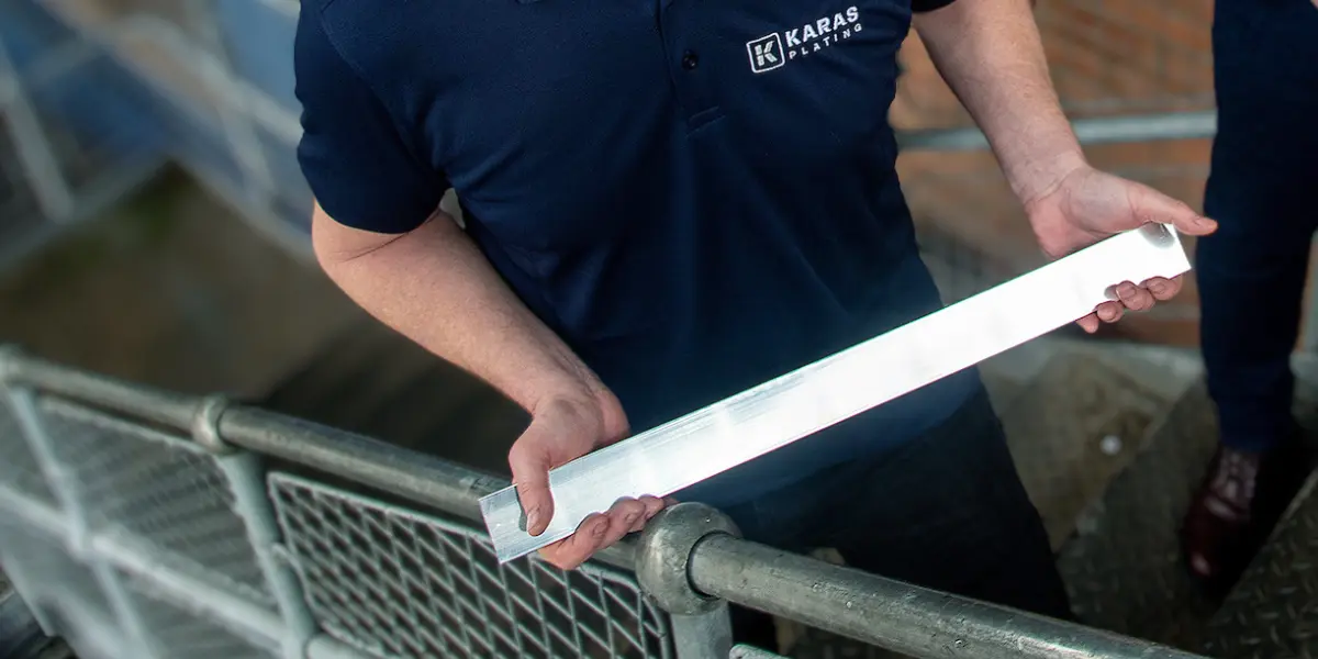 busbar electroplating Silver plated copper busbar being inspected by a Karas Plating technician