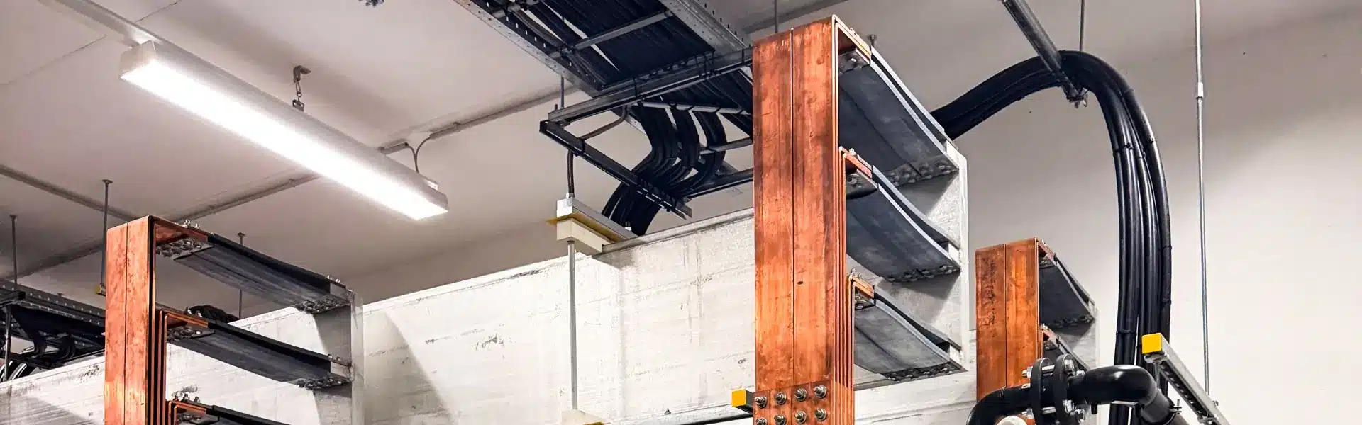 Copper busbars installed in an electrical switchboard, showing why busbars need electroplating to improve conductivity and prevent corrosion