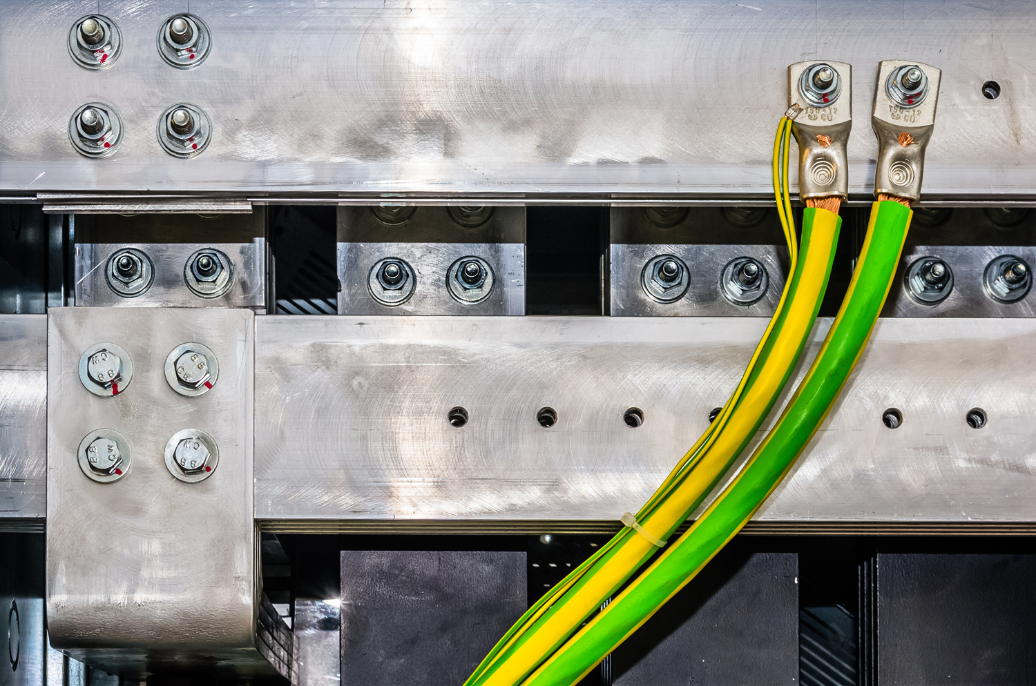 Closeup view on aluminum bars in electrical switchgear