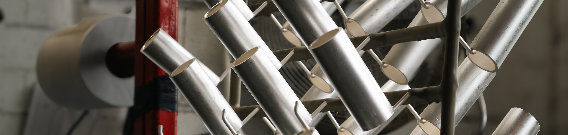 Some plated components hanging on a metal frame