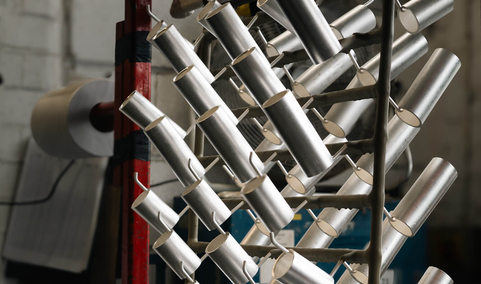 Some plated components hanging on a metal frame